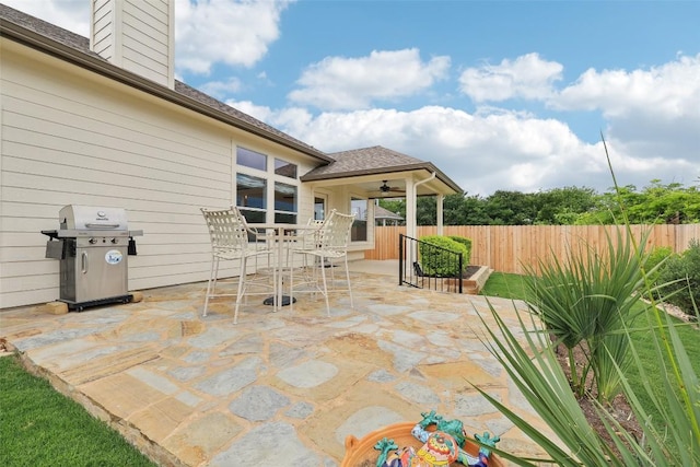 view of patio / terrace with outdoor dining area, a ceiling fan, fence, and area for grilling