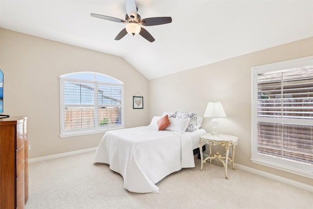 bedroom with baseboards, a ceiling fan, carpet, and lofted ceiling