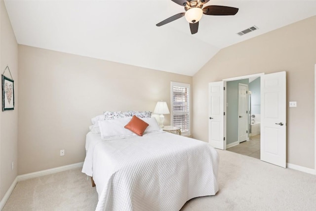 carpeted bedroom with a ceiling fan, baseboards, visible vents, and vaulted ceiling