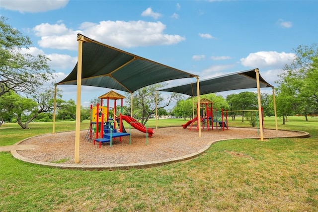 community play area featuring a lawn