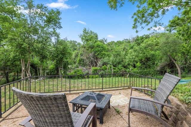 3910 Wendy Oaks Dr, Temple, TX 76502 - view of patio / terrace featuring an outdoor fire pit and view of wooded area