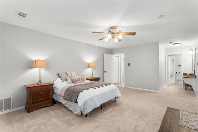 3910 Wendy Oaks Dr, Temple, TX 76502 - bedroom featuring light carpet, ceiling fan, and ensuite bathroom