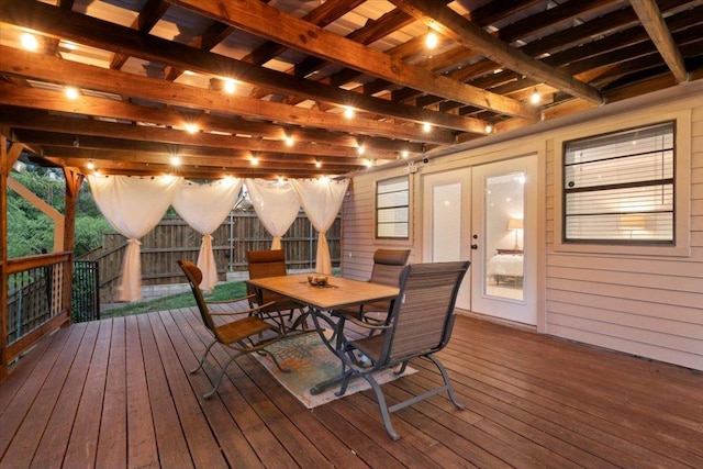 wooden deck featuring fence and outdoor dining area