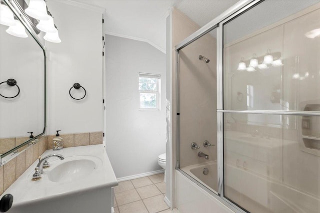 full bathroom with tile patterned flooring, vanity, shower / bath combination with glass door, toilet, and baseboards