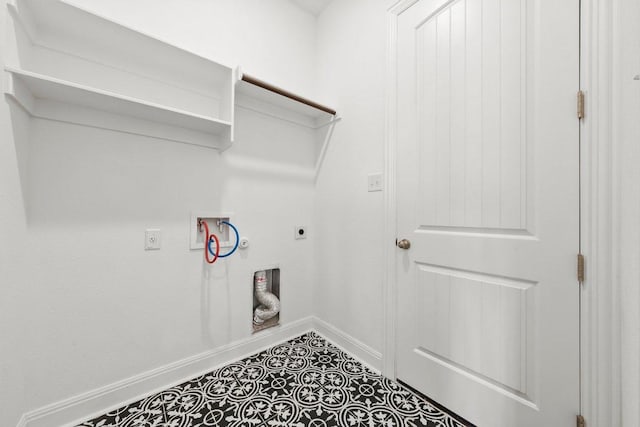 laundry area with gas dryer hookup, hookup for an electric dryer, laundry area, baseboards, and hookup for a washing machine