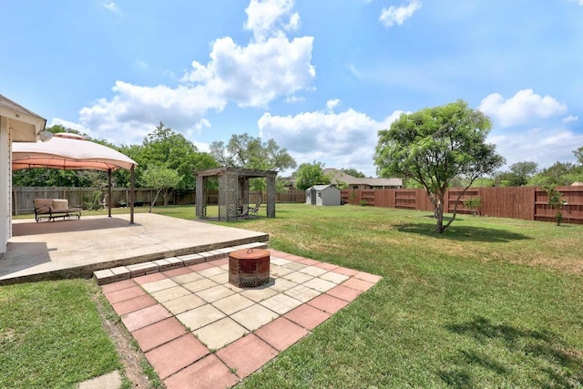 4325 Dos Cabezas Dr, Austin, TX 78749 - view of yard featuring a shed, a patio area, a gazebo, an outbuilding, and a fire pit