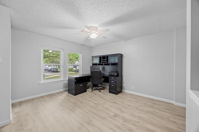 4325 Dos Cabezas Dr, Austin, TX 78749 - office space with a ceiling fan, light wood-type flooring, a textured ceiling, and baseboards