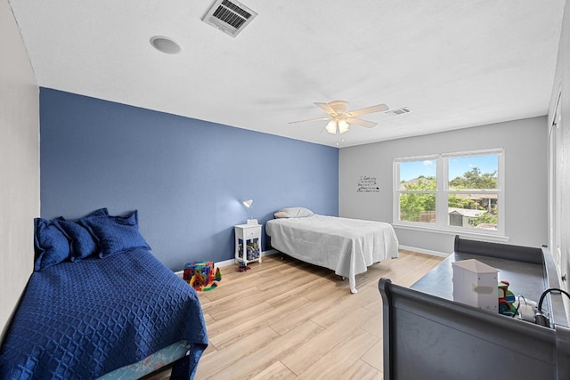 4325 Dos Cabezas Dr, Austin, TX 78749 - bedroom featuring light wood-type flooring, baseboards, and a ceiling fan
