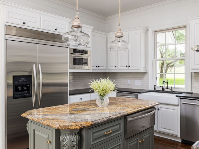 kitchen featuring appliances with stainless steel finishes, a sink, gray cabinetry, a warming drawer, and white cabinetry