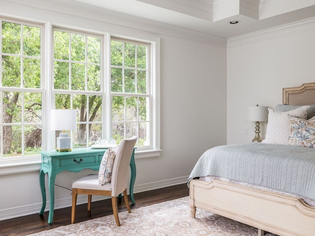bedroom featuring baseboards, ornamental molding, and wood finished floors