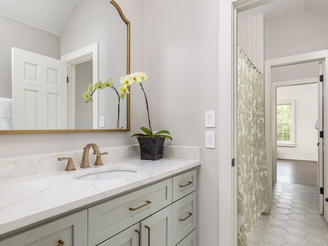 1350 Patterson Rd, Austin, TX 78733 - full bath featuring vanity, lofted ceiling, and tile patterned flooring