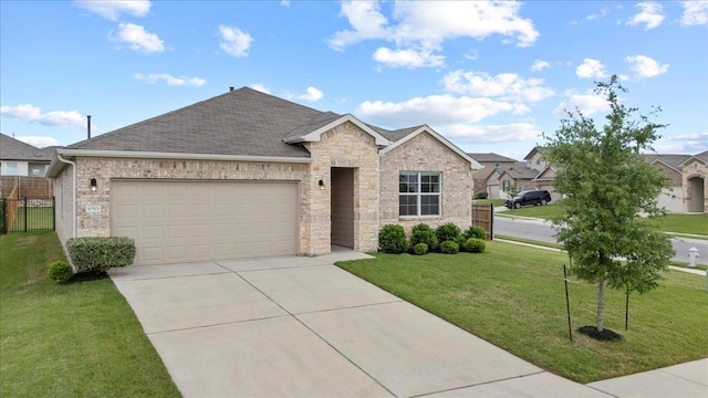 single story home featuring stone siding, a front yard, a shingled roof, an attached garage, and driveway