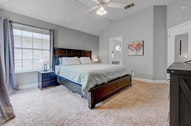 carpeted bedroom with connected bathroom, ceiling fan, visible vents, baseboards, and vaulted ceiling