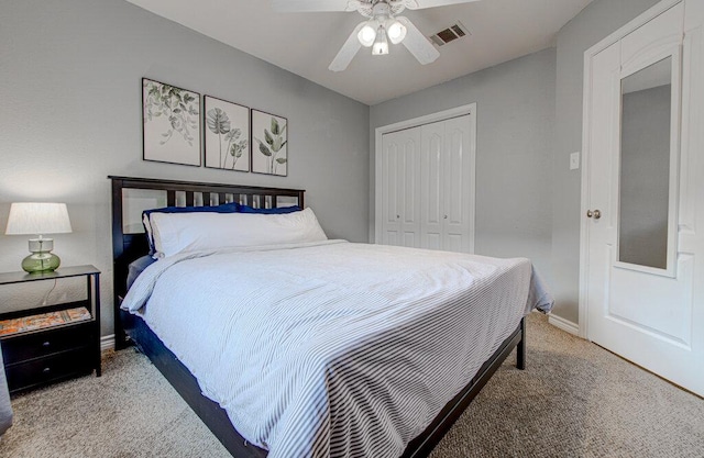 bedroom with visible vents, carpet flooring, baseboards, and a closet