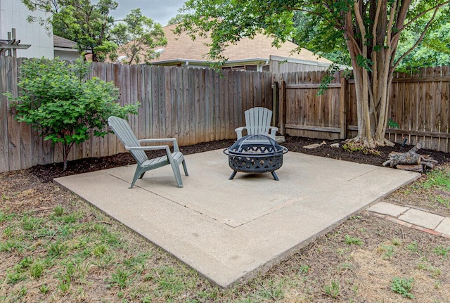 view of patio / terrace with a fenced backyard and an outdoor fire pit