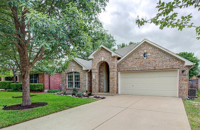 view of front of property with a front yard, roof with shingles, brick siding, an attached garage, and driveway