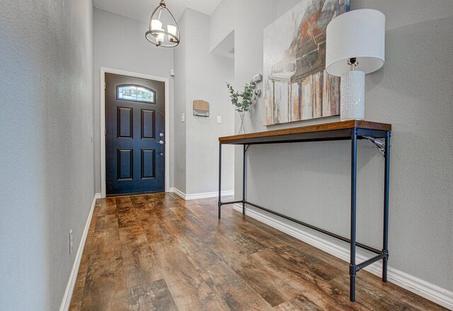 4807 Rutherglen Dr, Austin, TX 78749 - foyer with wood finished floors, baseboards, and a towering ceiling