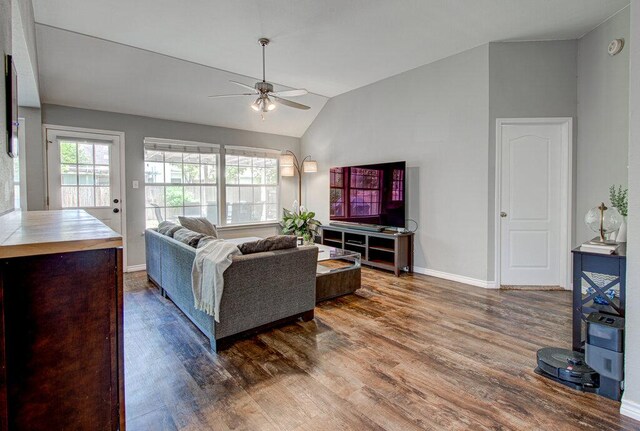 4807 Rutherglen Dr, Austin, TX 78749 - living area with lofted ceiling, a ceiling fan, wood finished floors, plenty of natural light, and baseboards