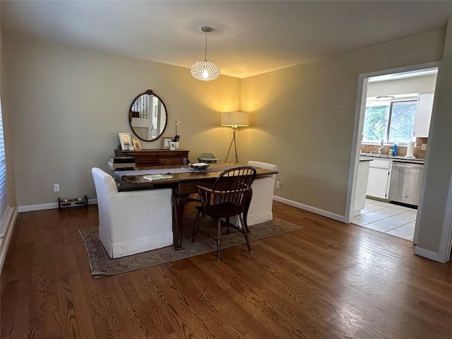 interior space featuring baseboards and wood finished floors