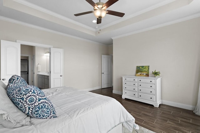 bedroom featuring crown molding, dark wood-style flooring, ceiling fan, baseboards, and a tray ceiling