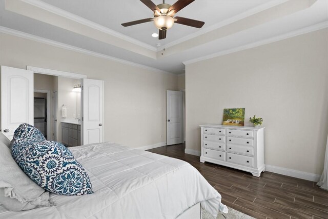 17111 Calipatria Ln, Pflugerville, TX 78660 - bedroom featuring baseboards, dark wood-style floors, crown molding, a tray ceiling, and a ceiling fan