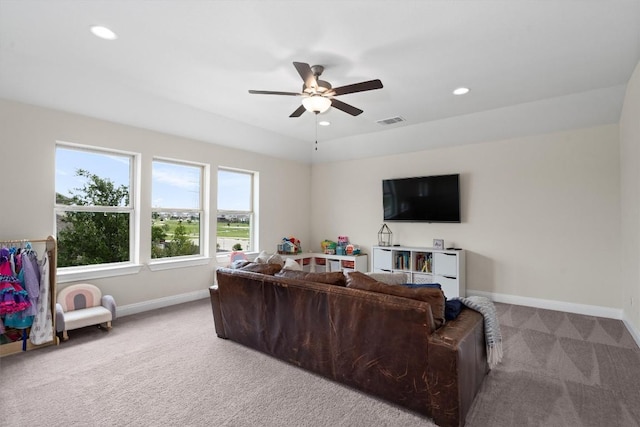 carpeted living room with baseboards, a ceiling fan, recessed lighting, and visible vents