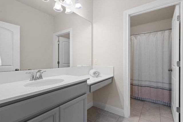 17111 Calipatria Ln, Pflugerville, TX 78660 - bathroom with vanity, tile patterned flooring, baseboards, and a chandelier