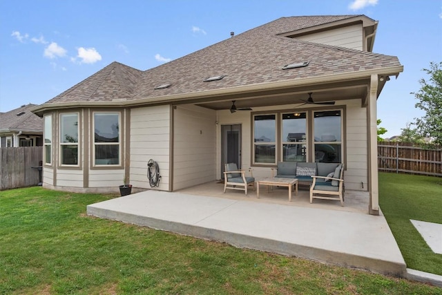 rear view of house with fence, a ceiling fan, an outdoor hangout area, and a patio area