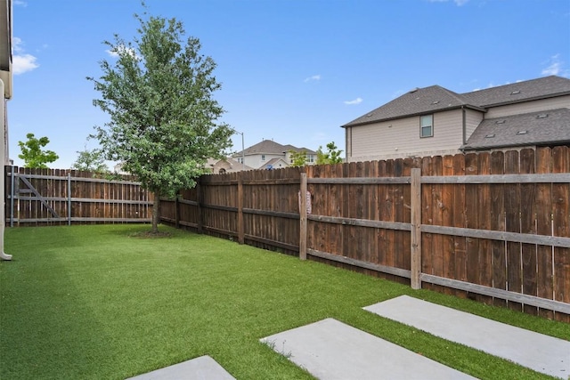 view of yard with a fenced backyard and a patio