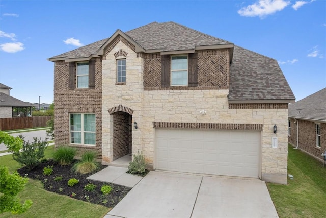 17111 Calipatria Ln, Pflugerville, TX 78660 - view of front of property with stone siding, roof with shingles, driveway, and a garage