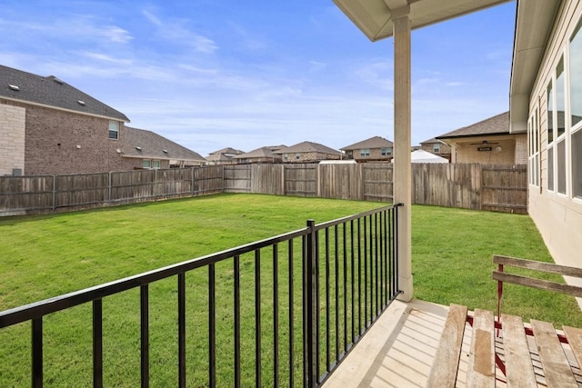 view of yard featuring a residential view and a fenced backyard