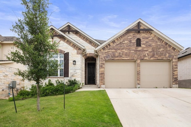 french country style house featuring a front lawn, stone siding, brick siding, concrete driveway, and an attached garage