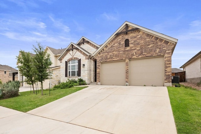 french provincial home with a front yard, brick siding, concrete driveway, an attached garage, and central air condition unit