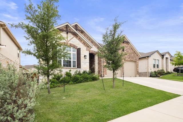 view of front of house featuring a garage, brick siding, a front lawn, concrete driveway, and stone siding