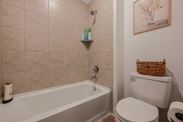 bathroom with shower / tub combination and toilet