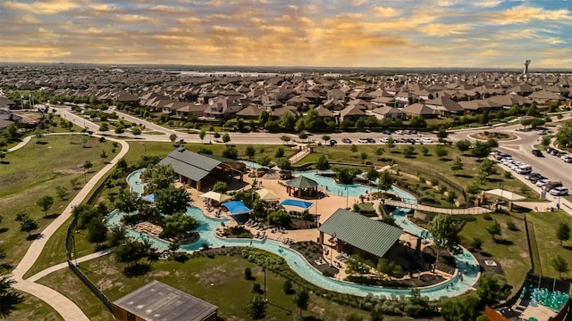 birds eye view of property with a residential view