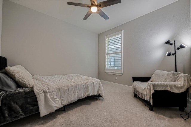 bedroom featuring baseboards, ceiling fan, lofted ceiling, and light colored carpet