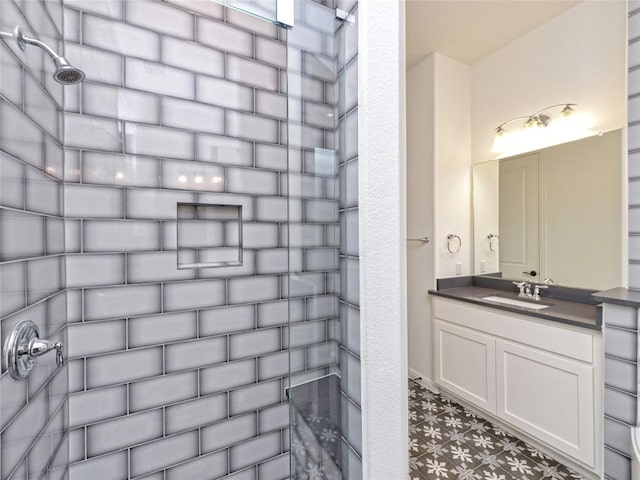full bath featuring vanity and tile patterned floors
