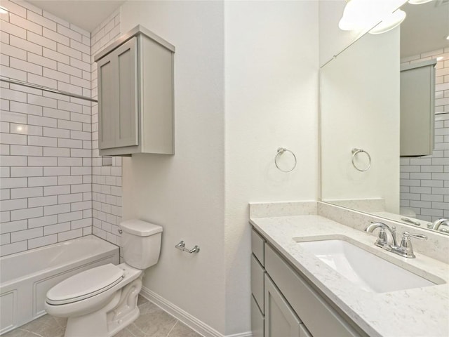 bathroom with tile patterned flooring, shower / washtub combination, vanity, baseboards, and toilet
