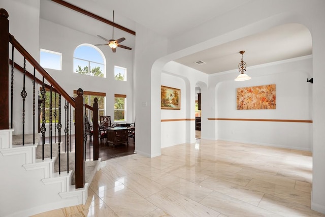 715 Nelson Ranch Rd, Cedar Park, TX 78613 - entryway with arched walkways, ceiling fan, stairs, and marble finish floor