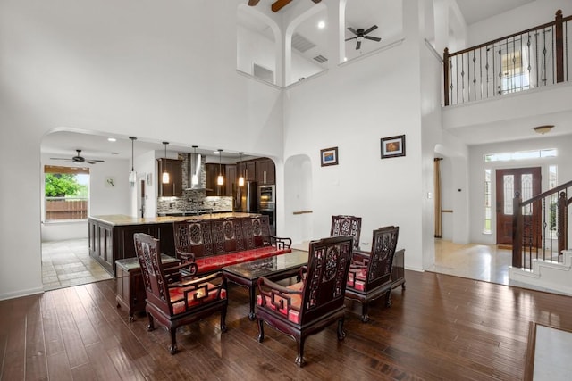 715 Nelson Ranch Rd, Cedar Park, TX 78613 - living area featuring wood-type flooring, visible vents, a high ceiling, arched walkways, and a ceiling fan