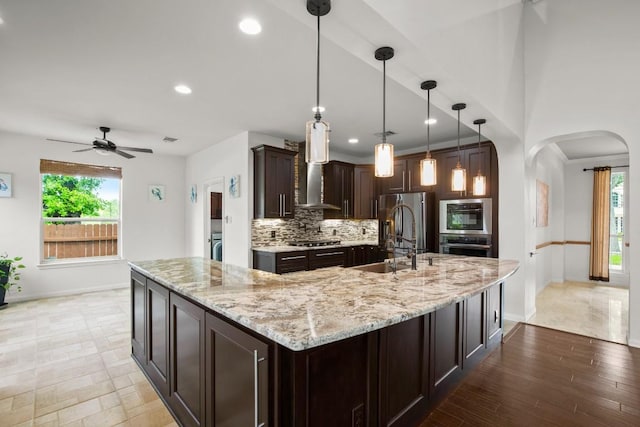 715 Nelson Ranch Rd, Cedar Park, TX 78613 - kitchen with a ceiling fan, baseboards, appliances with stainless steel finishes, and a sink