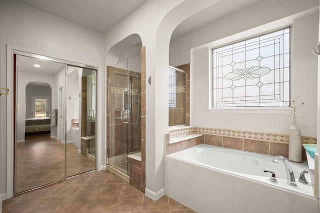 715 Nelson Ranch Rd, Cedar Park, TX 78613 - full bath featuring tile patterned flooring, a stall shower, a garden tub, and connected bathroom