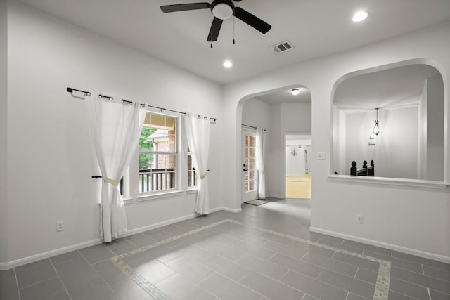 715 Nelson Ranch Rd, Cedar Park, TX 78613 - empty room with arched walkways, a ceiling fan, visible vents, and baseboards