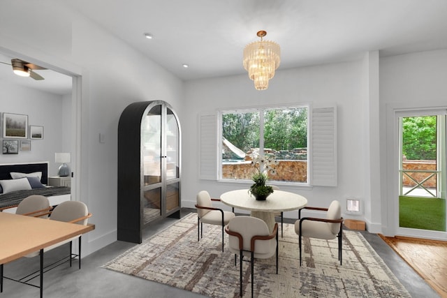 111 Crest View Dr, Lakeway, TX 78734 - dining area with a chandelier and baseboards