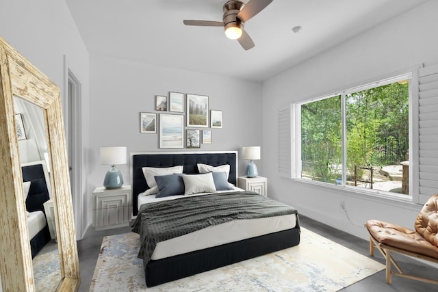 111 Crest View Dr, Lakeway, TX 78734 - bedroom featuring a ceiling fan, concrete floors, and baseboards