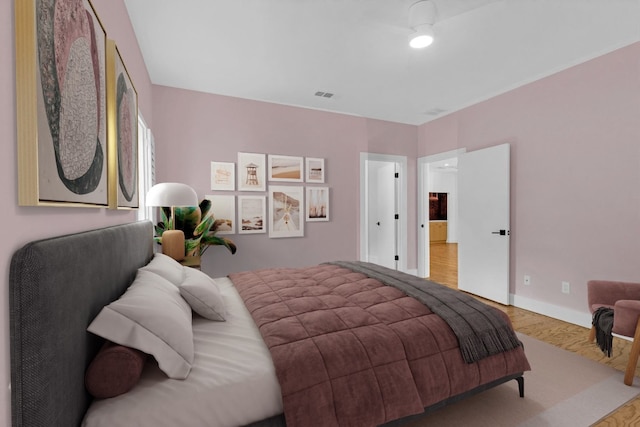 111 Crest View Dr, Lakeway, TX 78734 - bedroom with wood finished floors and baseboards