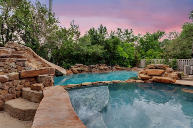 111 Crest View Dr, Lakeway, TX 78734 - view of pool with a water slide and a pool with connected hot tub
