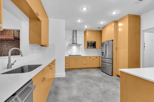kitchen with wall chimney range hood, tasteful backsplash, a sink, light countertops, and stainless steel appliances