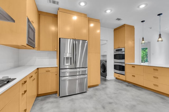 111 Crest View Dr, Lakeway, TX 78734 - kitchen featuring appliances with stainless steel finishes, washer / clothes dryer, concrete floors, decorative backsplash, and light countertops